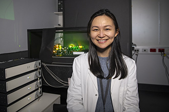 Cindy Evelyn in front of the lattice light sheet microscope